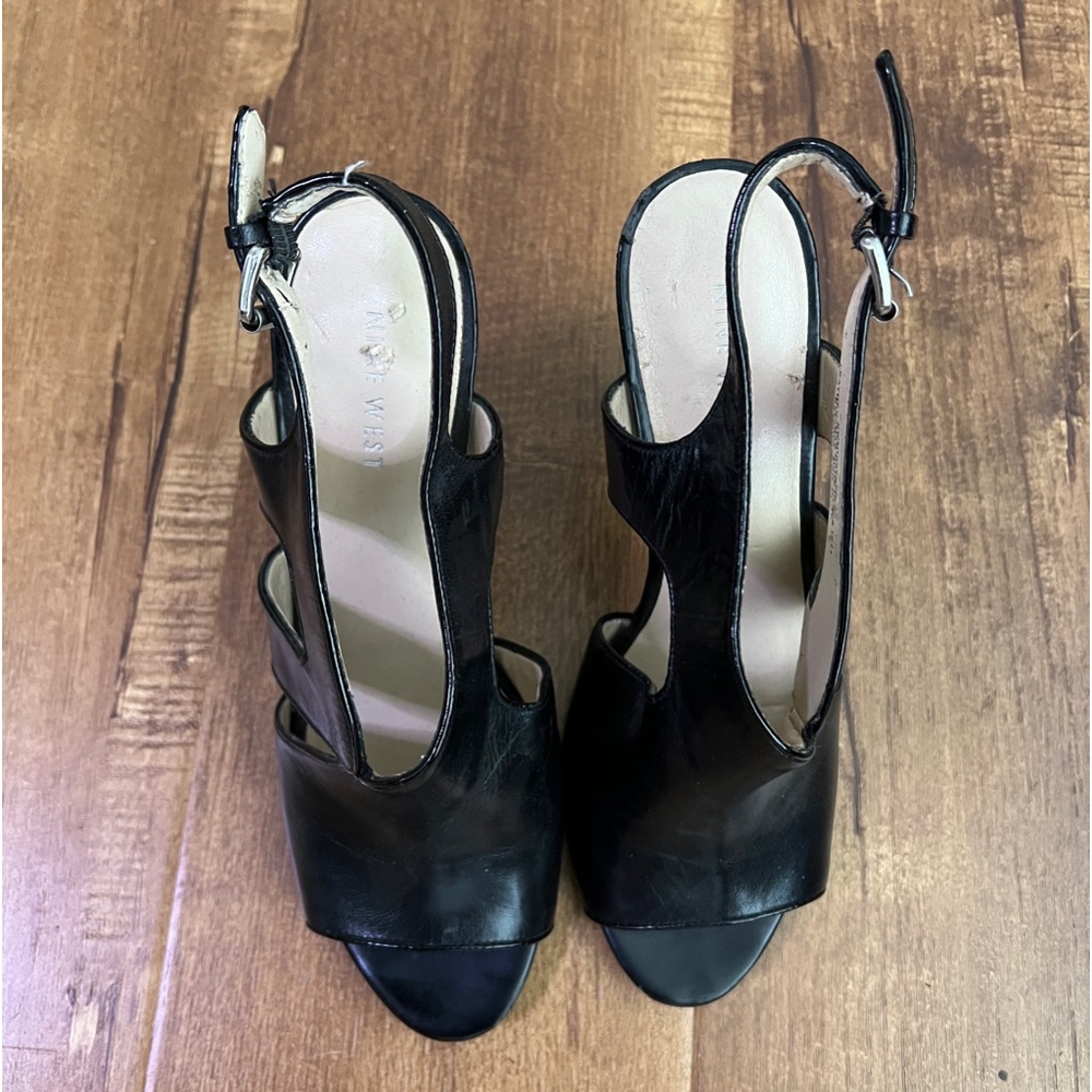 Nine West open-toe black heeled sandal.  Size 8.5. Slight wear at heel edge.